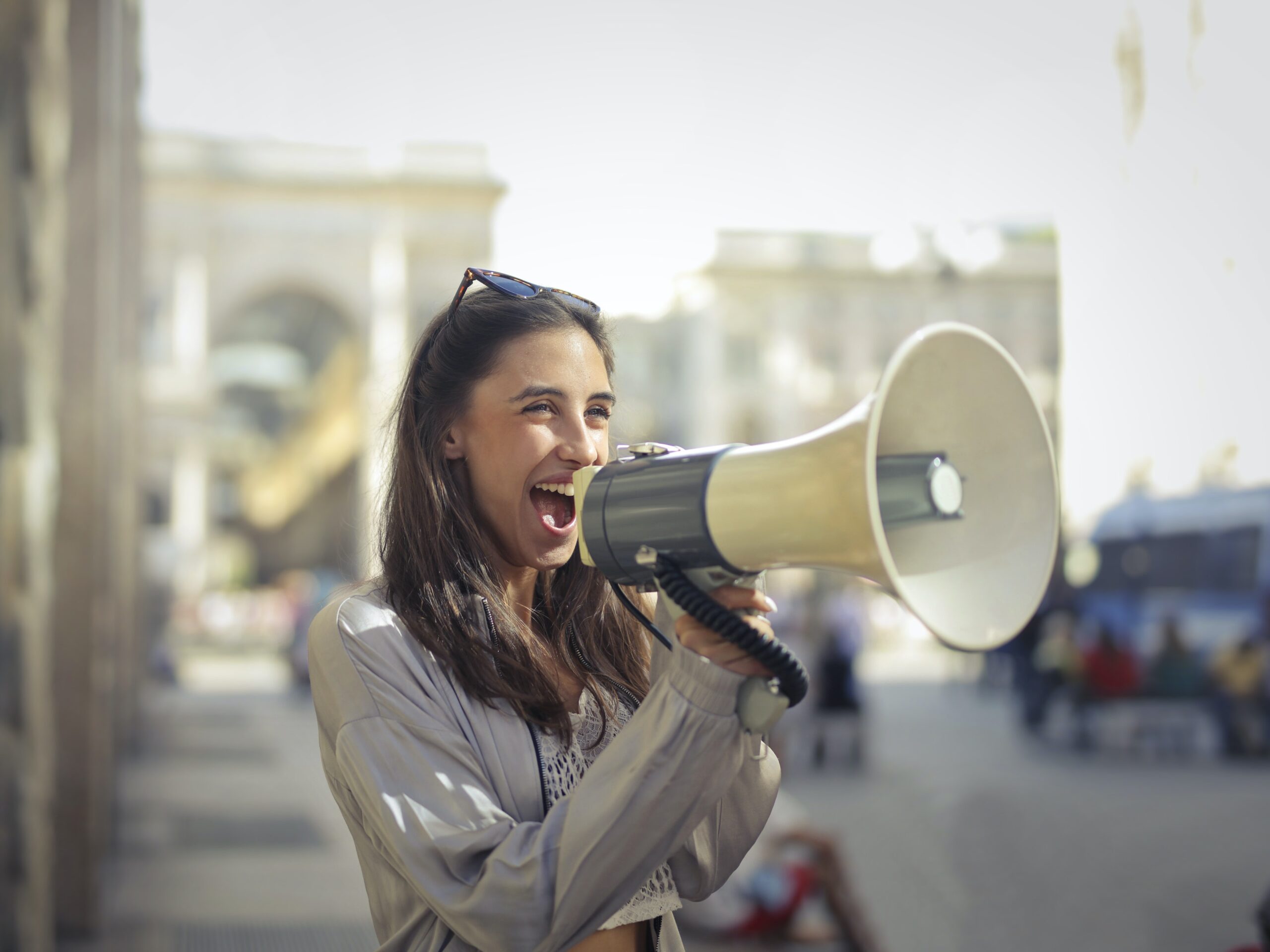 Woman with a bullhorn shouting