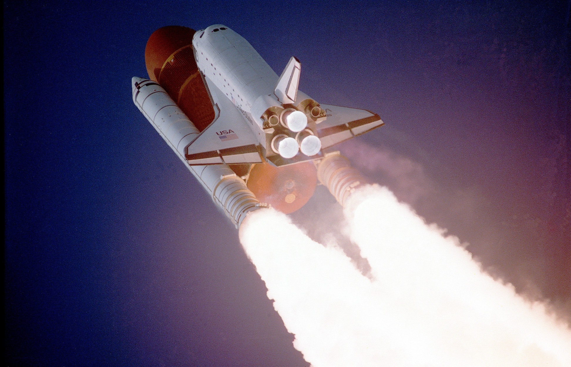 Space shuttle lifting off