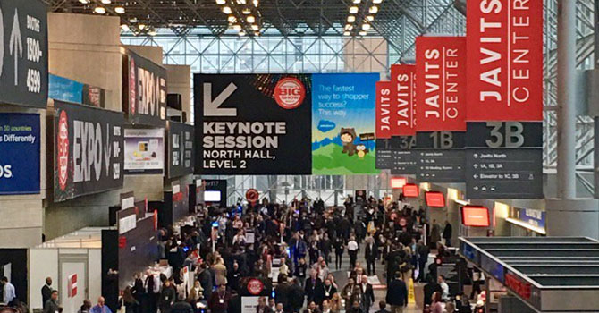 Large conference hall full of people at business event