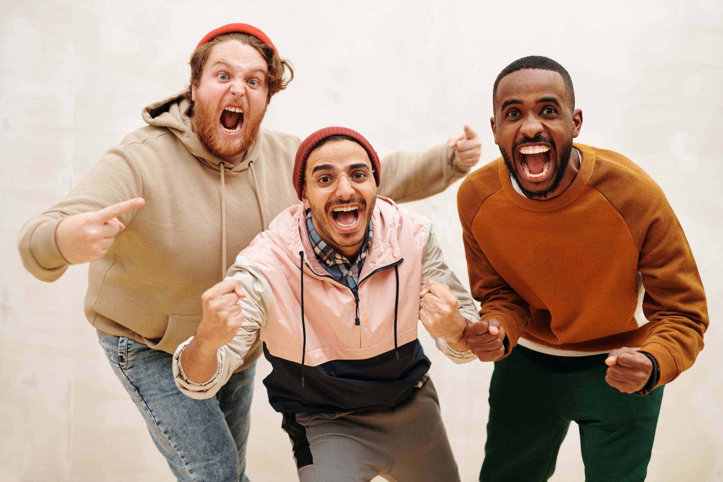 Three young men celebrating