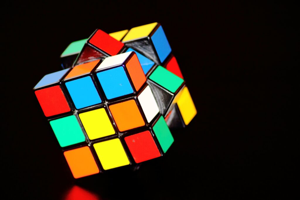 A rubic's cube against a black background